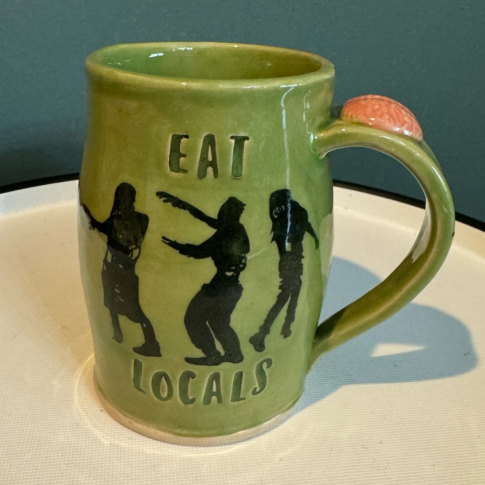 Studio Art Pottery Zombies “Eat Locals” Green Ceramic Mug with Brain on Handle